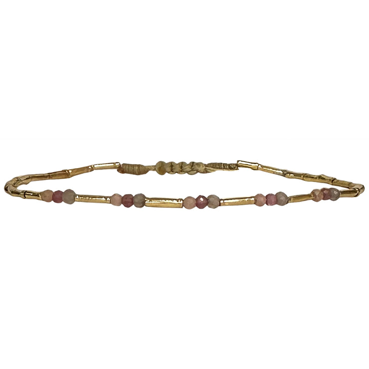 Delighted to introduce this delicate design to our collection.   This beautiful bracelet with a scattering of semi precious stones is sure to add elegance to any outfit. Can be worn solo or layered with your favourites bracelets.  Details:  - Women bracelet  - Vermeil tubes  - Intermixed semi-precious stones  -Adjustable bracelet  -Width: 2mm