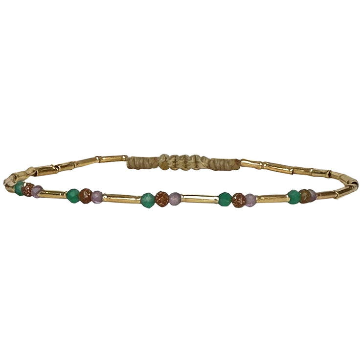 Delighted to introduce this delicate design to our collection.   This beautiful bracelet with a scattering of semi precious stones is sure to add elegance to any outfit. Can be worn solo or layered with your favourites bracelets.  Details:  - Women bracelet  - Vermeil tubes  - Intermixed semi-precious stones  -Adjustable bracelet  -Width: 2mm