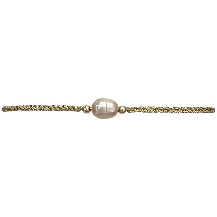 Make a confident statement with this delicate handmade bracelet. This design is handwoven by our team of artisans using metallic threads,14k gold filled beads and a freshwater pearl.  This bracelet is elegant and femenine, making it the perfect accessory for any occasion.  Details  - Metallic thread  - Freshwater pearl  - 14 k gold filled beads  - Adjustable Bracelet  -Width: 2mm  -Can be worn in the  wate