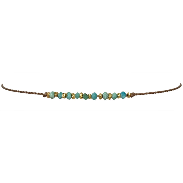 Handmade Kora Bracelet Featuring Gold And Turquoise Stones