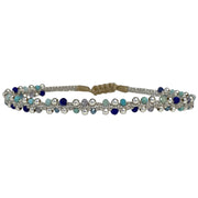 This delicate and beautiful bracelet is handwoven by our team of artisans using semi-precious stones mixed with 925 sterling silver beads and metallic threads.   You can wear it with your favourite bracelets all season long.   Details:  -Semi-precious stones  -925 sterling silver beads details   -Adjustable bracelet  -Width: 4mm  -Can be worn in the  water