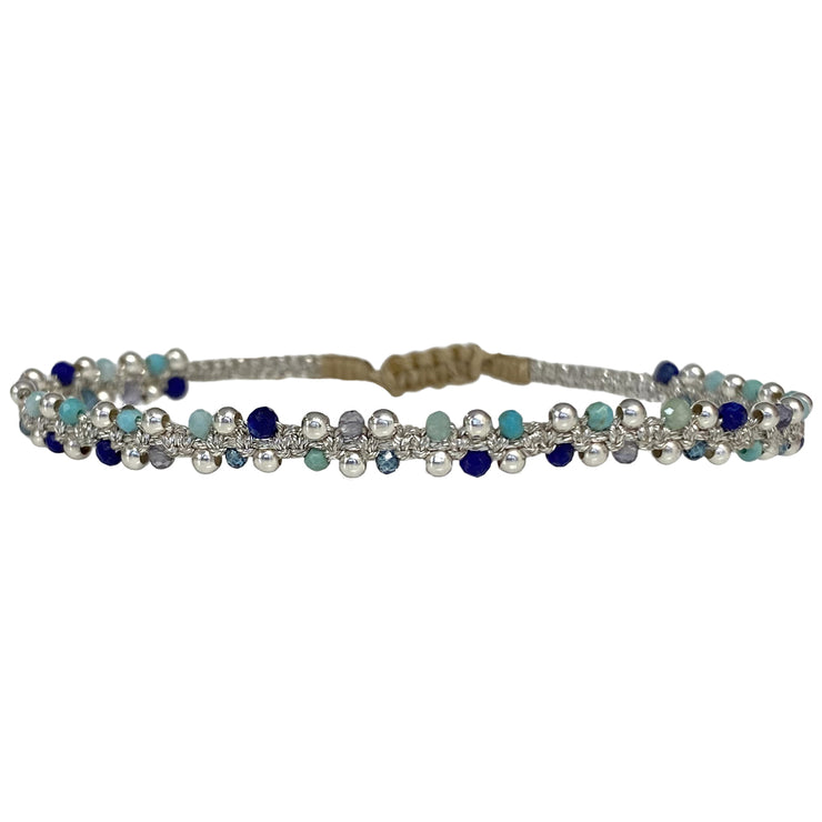 This delicate and beautiful bracelet is handwoven by our team of artisans using semi-precious stones mixed with 925 sterling silver beads and metallic threads.   You can wear it with your favourite bracelets all season long.   Details:  -Semi-precious stones  -925 sterling silver beads details   -Adjustable bracelet  -Width: 4mm  -Can be worn in the  water