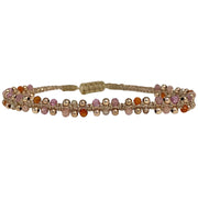This delicate and beautiful bracelet is handwoven by our team of artisans using semi-precious stones mixed with 14K rose gold filled beads and metallic threads.   You can wear it with your favourite bracelets all season long.   Details:  -Semi-precious stones  -14k rose gold filled beads details   -Adjustable bracelet  -Width: 4mm  -Can be worn in the  water
