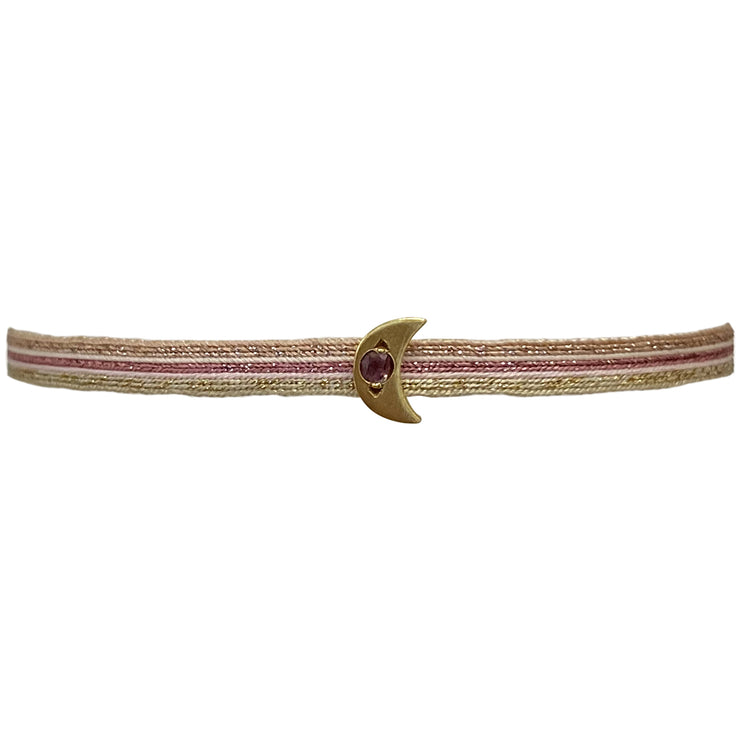 This delicate bracelet is handmade by our team of master artisans using polyester threads and a moon charm encrusted with a sparkling pink tourmaline stone. It&