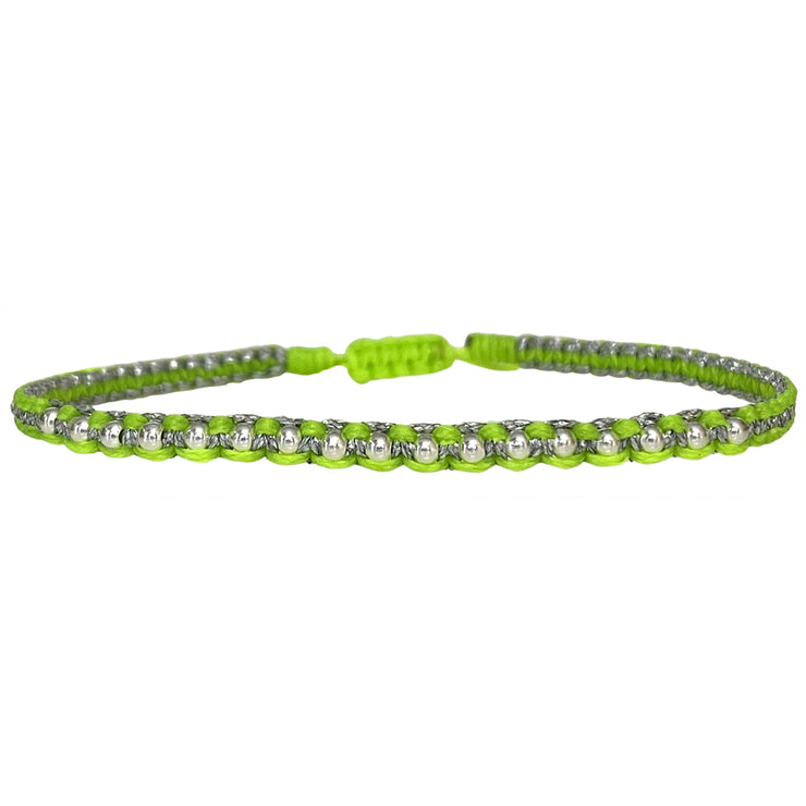 Add a pop of color to your look with this beautiful neon bracelet. It is handwoven by our team of artisans using 925 silver beads and metallic threads.  Details:  - Women bracelet  - 925 sterling silver beads details  -Adjustable bracelet  -Width: 4mm  -Can be worn in the water