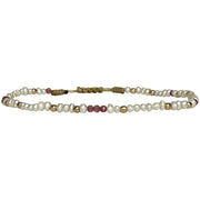 This delicate jewel is handmade using an array of semi-precious stones and 14k gold filled beads. This beauty will be one of your favs bracelets as you can wear it with any accessories or outfits. Give to your looks a touch of elegance and sparkle !  Details:  - Freshwater pearls and pink tourmaline semi-precious stones  -14 k gold filled beads  - Adjustable bracelet  - width: 2mm  -Can be worn in the water