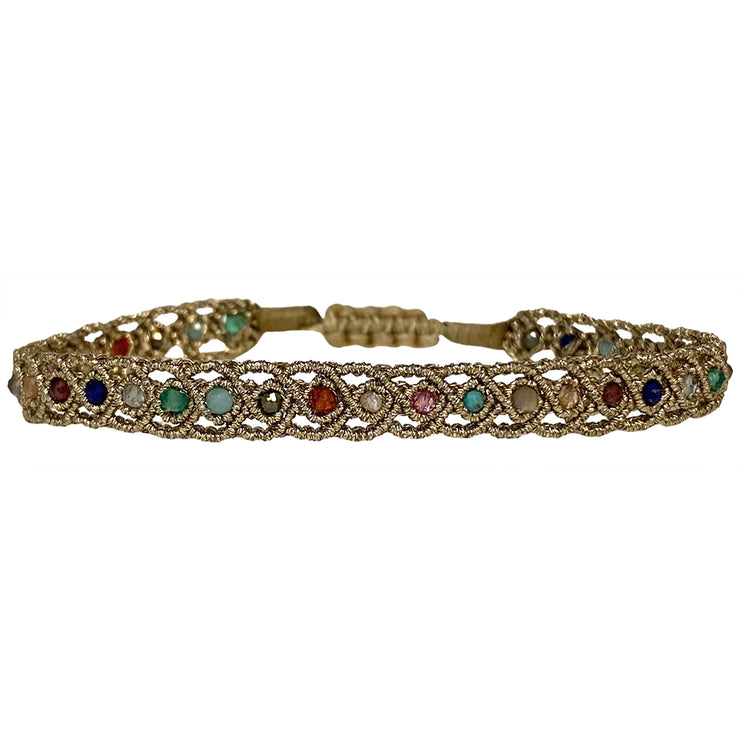 If you wish for simple elegance and versatility this handmade bracelet is just for you. It is handwoven by our team of artisans using intermixed semi-precious stones and metallic threads.  Details:  - Women bracelet  - Semi precious stones  -Adjustable bracelet  -Width: 5mm  -Can be worn in the water