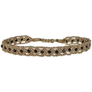 HANDWOVEN ROMA BRACELET IN GOLD TONES FEATURING SPINEL STONE DETAIL
