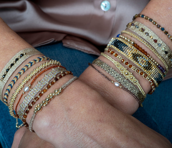 HANDWOVEN HOLLY BRACELET FEATURING HESSONITE STONES AND GOLD