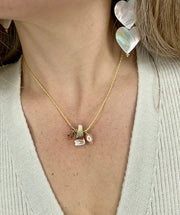 Shell Necklace With A Golden Pearl and a Peace Charm Detail