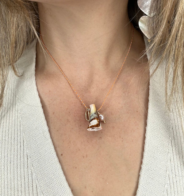 Shell Necklace With A Golden Pearl and a Shell Charm Detail