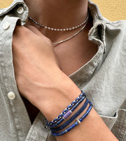 This cool bracelet is adorned with lapis lazuli stones. The highlights are silver Beads and one original african trade bead.  This bracelet looks great worn solo or layered with other pieces.  Details:  -Men's bracelet  -Original african trade bead  -Lapis lazuli stone  -sterling silver details  -Adjustable bracelet   -Width 4mm  -Can be worn in the water