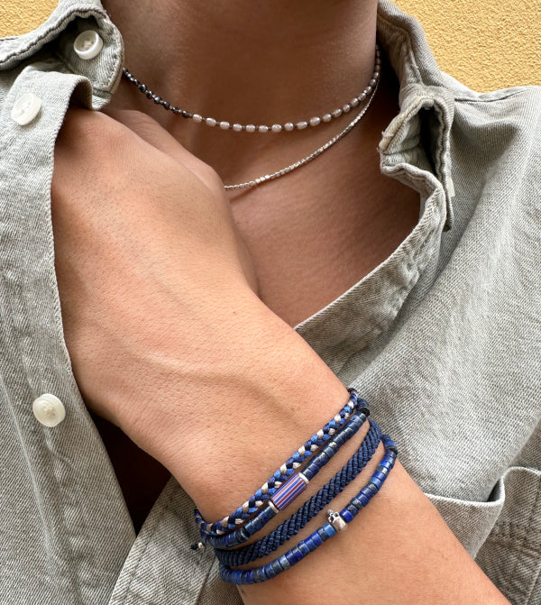 This cool bracelet is adorned with lapis lazuli stones. The highlights are silver Beads and one original african trade bead.  This bracelet looks great worn solo or layered with other pieces.  Details:  -Men&