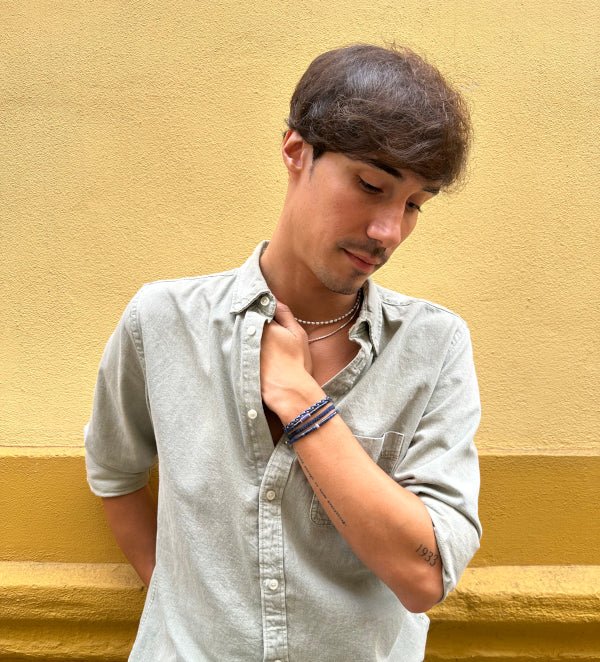 This cool bracelet is adorned with lapis lazuli stones. The highlights are silver Beads and one original african trade bead.  This bracelet looks great worn solo or layered with other pieces.  Details:  -Men&