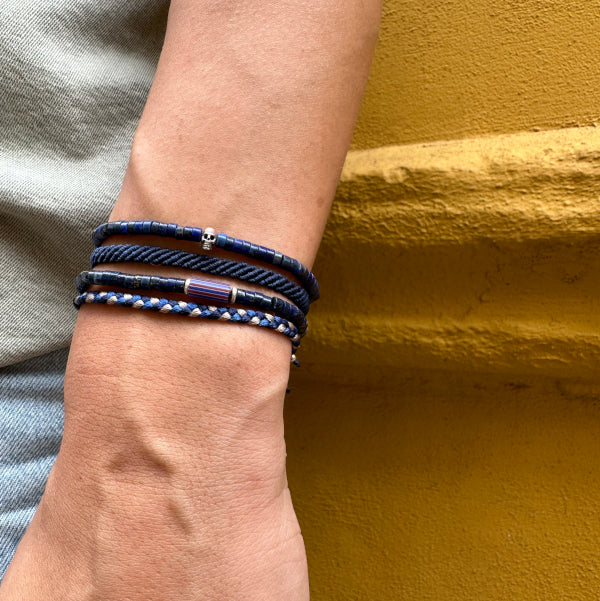 This cool bracelet is adorned with lapis lazuli stones. The highlights are silver Beads and one original african trade bead.  This bracelet looks great worn solo or layered with other pieces.  Details:  -Men&