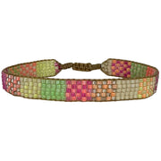   This cool bracelet is handwoven by our team of artisans in Colombia using Japanese glass beads.   Wear it with your favourite accessories !  Details:      Japanese glass beads     Handwoven adjustable bracelet     Width 9mm     Can be worn in the water