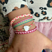  Barcelet Bliss!! This handmade wonder is the perfect splash of color and joy for the little ones!! They will never want to take them off, so let them play and play all day long!!  Details:  -Handmade Bracelet for kids  - Handwoven using Polyester  -Can be worn in the water - Width 5mm  -Can be worn in the  water