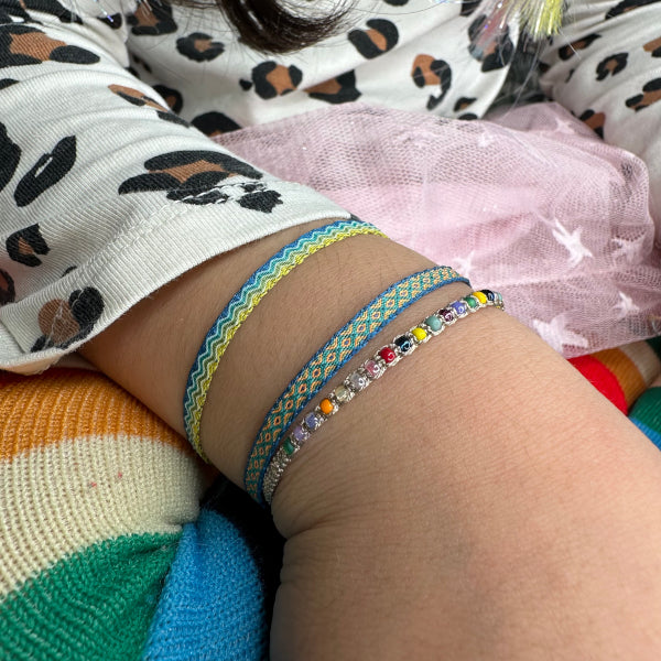  Barcelet Bliss!! This handmade wonder is the perfect splash of color and joy for the little ones!! They will never want to take them off, so let them play and play all day long!!  Details:  -Handmade Bracelet for kids  - Handwoven using Polyester  -Can be worn in the water - Width 3mm  -Can be worn in the  water