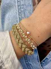 Radiant elegance metallic gold threads bracelet for effortlessly stylish and sophisticated looks.