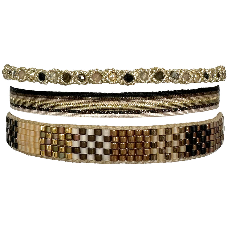 This beautifully bold set of three bracelets truly is "jewellery to make you smile". Using traditional artisanal handcrafting, each bracelet is hand-woven with techniques that take plenty of time and love. Wear yours stacked together or split between both wrists.  Details:      Intermixed semi-precious stones     14 k gold filled beads     Handwoven adjustable bracelet     Width 5mm, 8mm, 3mm     Can be worn in the water