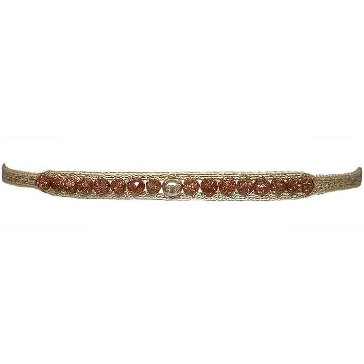 This LeJu bracelet has been handwoven in Colombia by our team of artisans using polyester threads featuring gold sandstone semi-precious stones and 14k gold filled bead  A delicate bracelet in an elegant design. This handmade beauty is the perfect gift for someone special.  Details:  - Gold sandstone semi-precious stones  - 14k gold filled bead  - Handwoven using polyester threads  - Width 3mm  -Women bracelet  - Adjustable bracelet  -Can be worn in the  water