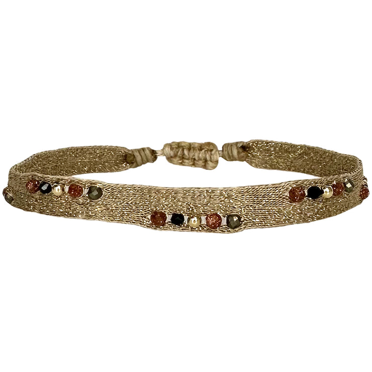 This beautiful design is handwoven by aour tema of master artisans using 80 threads and adorned with intermixed semi-precious stones and gold filled beads.  This elegantly designed bracelet will let you look effortlessly stylish and sophisticated whether you’re dressing up or going casual. Details:  - Handwoven using Polyester  - Intermixed Semi-precious stones  -14 k gold filled beads  - Can be worn in the water - Width 5 mm -Adjustable bracelet -Women bracelet