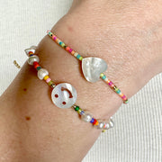 HANDMADE KIDS BRACELET FEATURING PEARLS AND A SMILE FACE CHARM