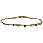 This bracelet has been handwoven in Colombia by our team of artisans using  metallic threads and spinel semi-precious stones and 14k filled beads.  Wear it with your favourite accessories .  Details:  - Spinel semi-precious stones  - Handwoven using metallic threads  - Width 3mm  - Adjustable bracelet  -Can be worn in the water
