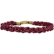The metallic fuchsia threads catch the light, creating a dazzling effect that is sure to turn heads. Whether you're attending a special occasion or looking to add a pop of color to your daily outfit, this bracelet offers the perfect solution.