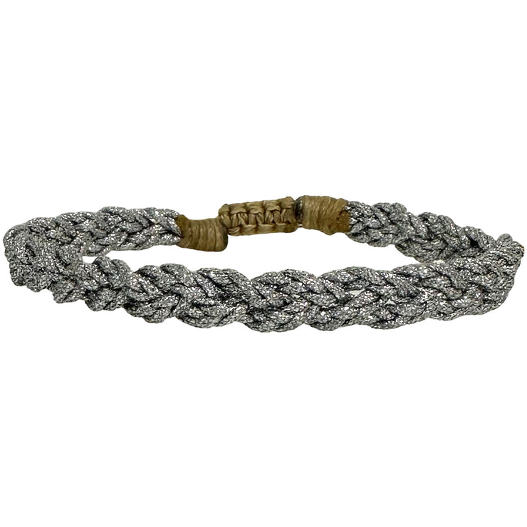 Embrace the elegance and beauty of the handmade Verina bracelet. With its metallic silver threads and timeless design, it is the perfect addition to your jewelry collection.