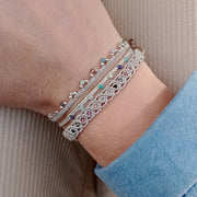 HANDWOVEN ROMA BRACELET IN SILVER TONES FEATURING GEMSTONES DETAIL