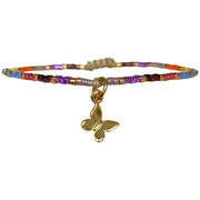 This beautiful kids bracelet is handwoven using Japanese glass beads and a 14k gold vermeil on 925 sterling silver butterfly charm.    Wear it with your favourite accessories!  Details:  -Kids bracelet  - Japanese glass beads  - 14k gold vermeil on 925 sterling silver charm   -Width: 2mm  -Adjustable bracelet