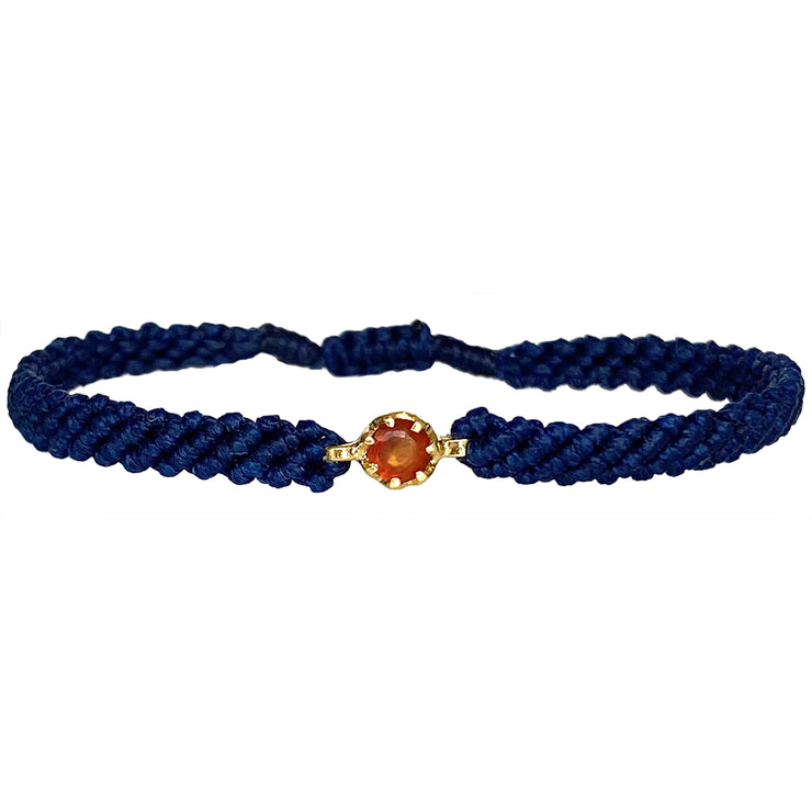 This gorgeus bracelet is handwoven by our team of master artisans using macramé techniques. An impressive Hessonite is the centerpiece of this iconic design. It&