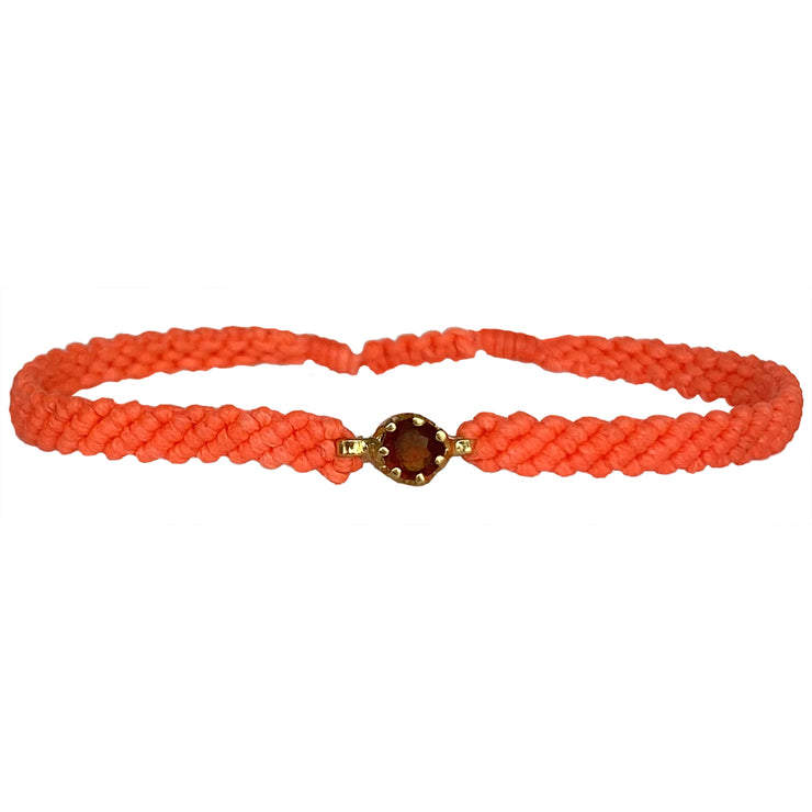 This gorgeus bracelet is handwoven by our team of master artisans using macramé techniques. An impressive Hessonite is the centerpiece of this iconic design. It&
