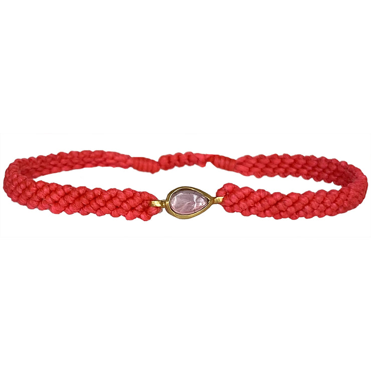 This gorgeus bracelet is handwoven by our team of master artisans using macramé techniques. An impressive Pink tourmaline is the centerpiece of this iconic design. It&