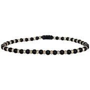 his cool bracelet is handmade by our team of masters artisans with black onyx stones and silver beads. A great gift idea for someone special as this amazing design it is a fashion must have.  Details:  -Men's bracelet  -Black Onyx Stones  -Sterling silver details  -Adjustable bracelet   -Width 4mm  -Can be worn in the water