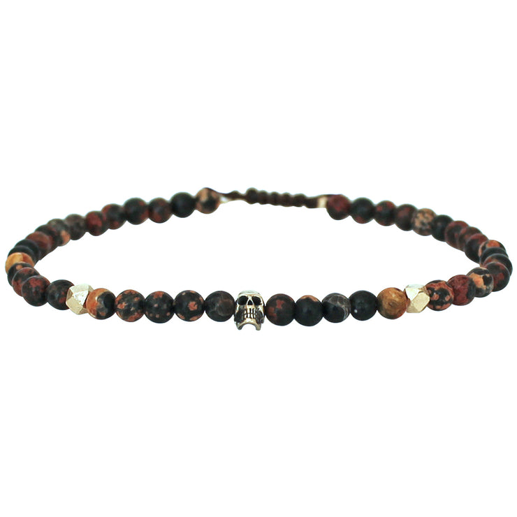   Expressive attitude meets artistic details.  This elaborately handcrafted piece of jewellery expresses strength and self-confidence.   Handmade using Jasper stones and silver skull charm, this cool bracelet will give to your looks a touch of authenticity  Details:  - Jasper stones  -Silver skull charm  -Adjustable bracelet for men   - Width: 5mm