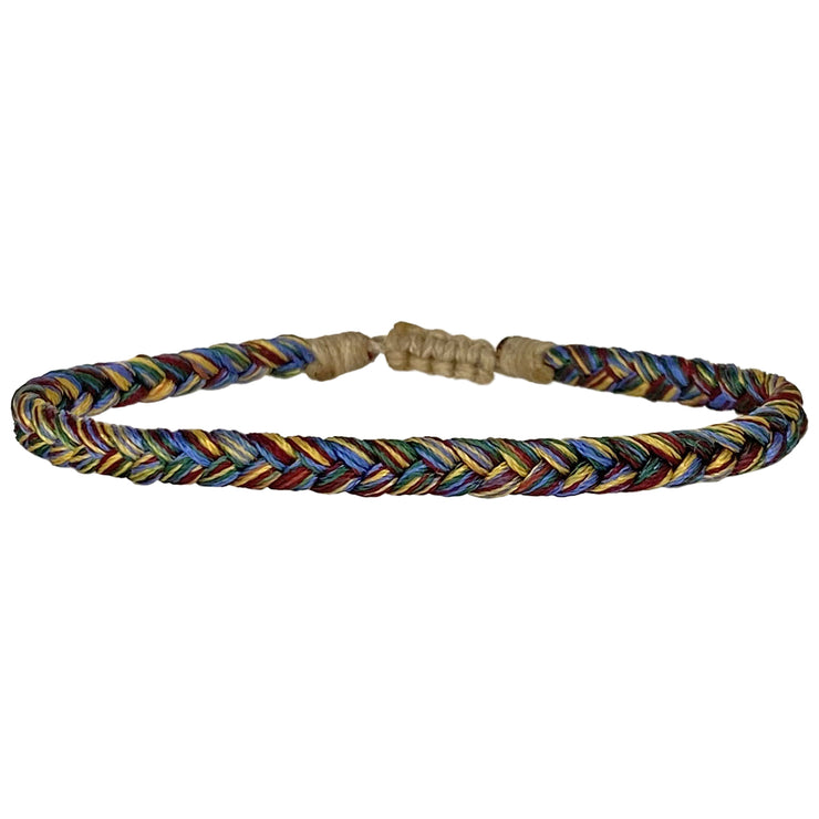 This bracelet is handwoven by our team of master artisans using polyester threads featuring a trenza design. This kids&