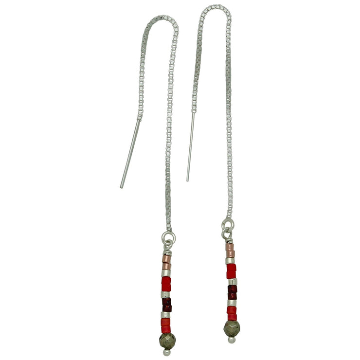 These unique LeJu earrings features  a delicate sterling silver chain connects to a strand of Japanese glass beads in red tones. Perfect for a gift for someone special or to treat yourself.  Details:    -Sterling silver chain   -Chrysoprase stone detail   -glass beads details   -Handcrafted in Colombia   -Measures 9.5cm  long 