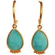 These beautiful handmade earrings featuring Turquoise stone representing hope and serenity, set in 14k gold vermeil setting. Bold and classic   -Metal: 14k gold plated vermeil   -Gemstone: Turquoise  -Earring height 1.5cm, Width 0.9mm  -Butterfly closure  -Care: Take care of your jewellery by keeping it dry and avoid spraying fragrances directly on to it.   -It comes with a card and a gift box   -Each piece has a unique shape as they are natural gemstones 