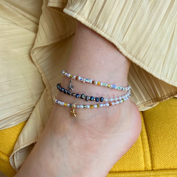This Anklet is handmade from freshwater pearls intermixed with sterling silver faceted beads  Details:  - Adjustable to your desired fit  - Handwoven by artisans in Colombia