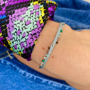 This LeJu bracelet has been ha silverndwoven in Colombia by our team of artisans using silver metallic threads featuring a sterling bead and intermixed semi-precious stones. Balancing the body, mind and spirit.  Details:  - Intermixed semi-precious stones  - 925 sterling silver bead  - Handwoven using metallic threads  - Width 3mm  -Women bracelet  - Adjustable bracelet