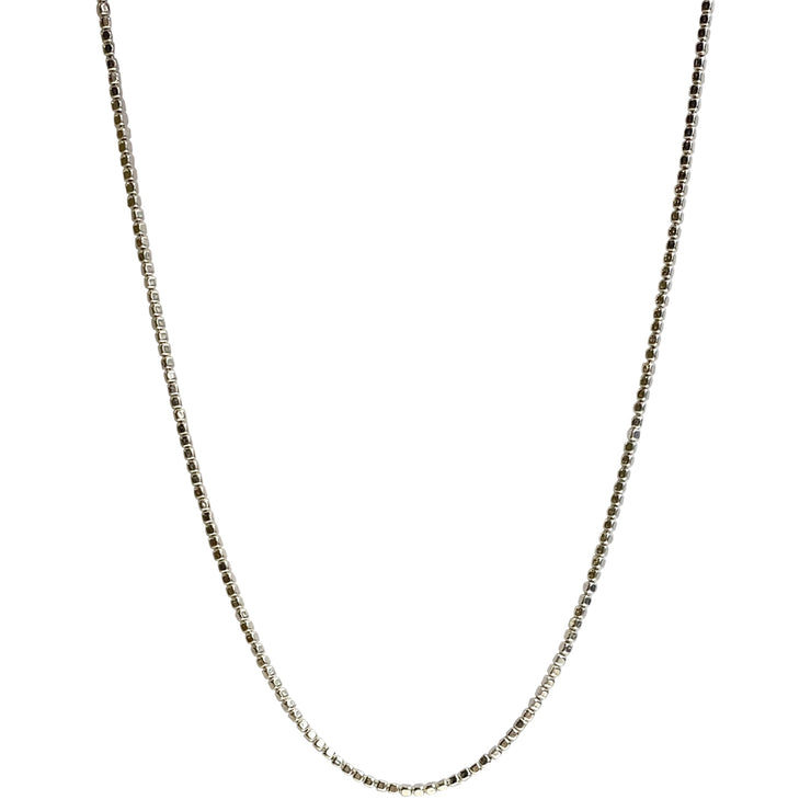 This delicate cube chain necklace is a jewellery box basic. Wear it alone, stack with other necklaces or add your favorite pendant.  Details:  Handmade necklace  Total necklace circumference 55 cm + extension chain 2cm  925 sterling silver  Handcrafted in Colombia