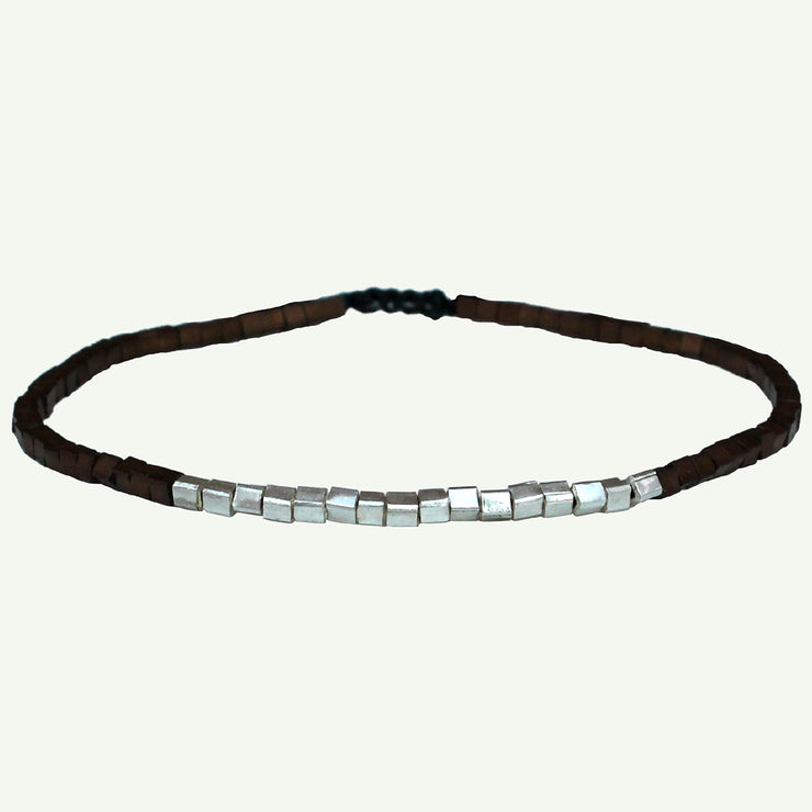 Handmade using  hematite stones and 925 sterling silver squares, this cool bracelet will give to your looks a touch of authenticity .  Details:  - Hematite stones   -925 sterling silver square details   -Adjustable bracelet for men   - Width: 2mm