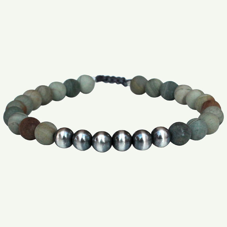 This handmade bracelet is consisting of jasper stones and 925 sterling silver details in the middle.   Wear it with your favourite bracelets!  Details:  -Men bracelet  -Jasper stones  -925 sterling silver   -Adjustable bracelet   -Width 4mm