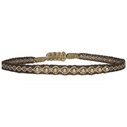 This LeJu bracelet has been handwoven in Colombia by our team of artisans using Polyester threads in brown tones with a row of 14 k gold filled beads  This can be worn solo or with your favourite pieces.  Details:      Polyester threads     14 k  gold filled beads     Handwoven adjustable bracelet     Width 4mm     Can be worn on the water