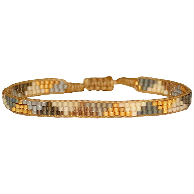 This cool bracelet is handwoven by our team of artisans in Colombia using Japanese glass beads.   Wear it with your favourite accessories !  Details:      Women bracelet     Handemade bracelet      Japanese glass beads     Adjustable bracelet     Width 5mm