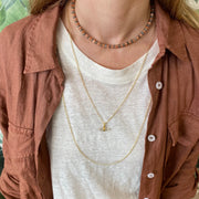 This unique necklace is handmade using a gold vermeil chain and a quartz stone as a center piece.  Wear it stacked with your favourites necklaces or alone as an everyday signature.      Gold vermeil chain and clasp closure     Measures 60 cm in length     Quartz Stone     Handmade necklace     Take care of your jewellery by keeping it dry and avoid spraying fragrances directly on to it. 