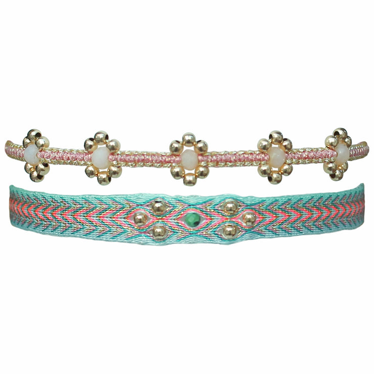 This stylish set is made up of two handmade bracelets. The first is woven using polyester threads in pink and blue tones with a turquoise stone and14 K gold filled beads. The second is woven using 5 pink opal stones and 14K gold filled beads. Both bracelets compliment each other perfectly and can be worn all season long.  Details:      14K gold filled beads     Pink Opal semi-precious stone     Turquoise semi-precious stone     Adjustable bracelets     Width: 7mm, 5mm