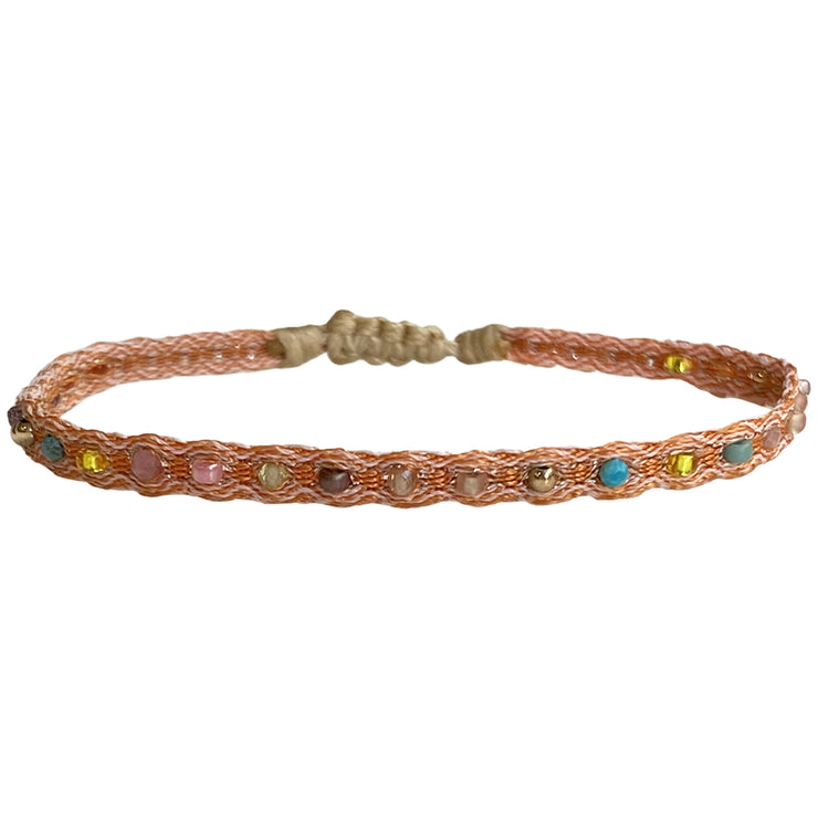   This bracelet combines a selection of Intermixed semi precious stones and 14K gold filled beads. It&